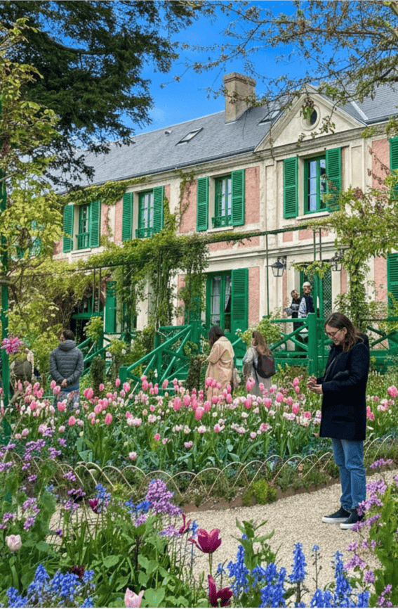 Claude Monet's house Giverny with spring tulips, Paris and Beyond Tours guide exploring Impressionist heritage