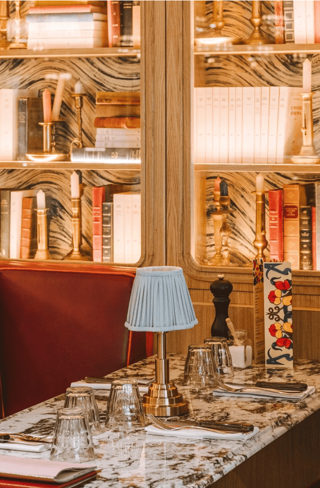 Brasserie des Prés Paris interior with elegant marble tables and literary decor, Kotryna's favourite restaurant recommendation