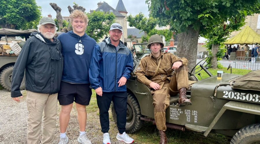 Multi-generational family D-Day reenactor Willys Jeep Sainte-Mère-Église - Paris and Beyond Tours private tour from Bayeux Caen