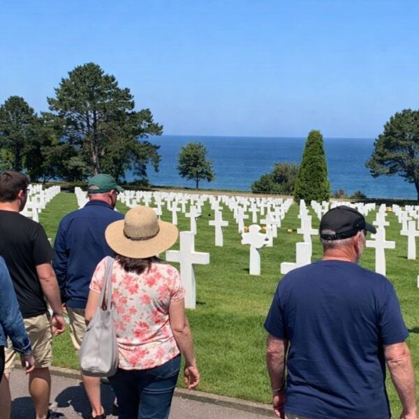 Tour group Normandy American Cemetery white crosses ocean view Omaha Beach - Paris and Beyond Tours D-Day from Bayeux Caen