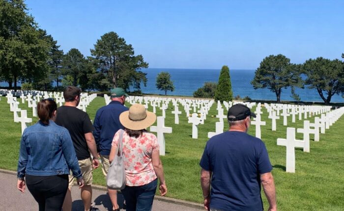 Tour group Normandy American Cemetery white crosses ocean view Omaha Beach - Paris and Beyond Tours D-Day from Bayeux Caen